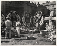 <span itemprop="name">Two men with floral wreaths and crosses....</span>