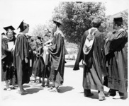 <span itemprop="name">A group of graduating students attending an event...</span>