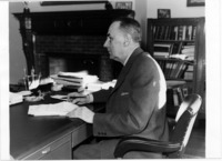 <span itemprop="name">A picture of John M. Sayles at his desk. Sayles...</span>