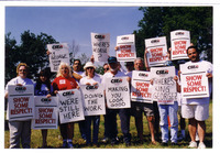 <span itemprop="name">CSEA members holding signs at a protest staged at...</span>