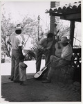 <span itemprop="name">Four men with guitars and a small child at ease in...</span>