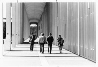 <span itemprop="name">Unidentified students walking by a building on the...</span>