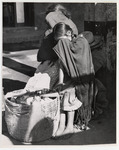 <span itemprop="name">A woman and a girl with a large basket covering...</span>