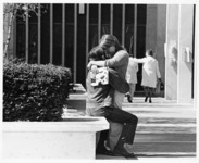 <span itemprop="name">Two unidentified students embracing at the State...</span>