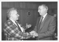 <span itemprop="name">Sam Wakshull (left) shaking hands with an...</span>
