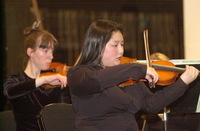 <span itemprop="name">Musicians in the string section rehearse for an...</span>