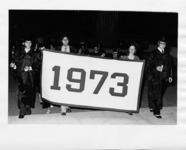 <span itemprop="name">A picture of students carrying a banner in a...</span>