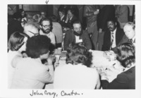 <span itemprop="name">John Crary (facing camera at left) and a group of...</span>