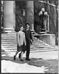 <span itemprop="name">Two unidentified students walking in front of the...</span>