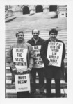 <span itemprop="name">Unidentified people holding signs and...</span>