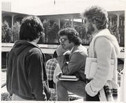 <span itemprop="name">Three unidentified male students talking on the...</span>
