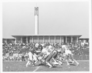 <span itemprop="name">A football game in play between the State...</span>