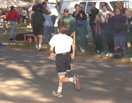 <span itemprop="name">Spectators cheer on a particularly young runner in...</span>