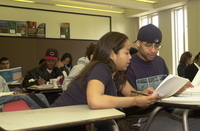 <span itemprop="name">Students help one another in an Educational...</span>