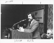 <span itemprop="name">Herb Magidson speaking from a podium during an...</span>