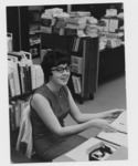 <span itemprop="name">Mary Osielski, Class of 1964, seated at her desk...</span>