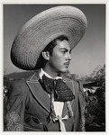 <span itemprop="name">A young man dressed in Charro attire with a large...</span>