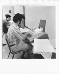 <span itemprop="name">Unidentified students at typewriters in the...</span>