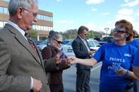 <span itemprop="name">Orange County Unit activist Susan Culver hands a...</span>