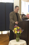 <span itemprop="name">An unidentified man addresses the audience at the...</span>