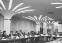 <span itemprop="name">A group of people attending a training meeting...</span>