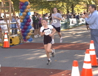 <span itemprop="name">Another very young runner reaches the finish line...</span>