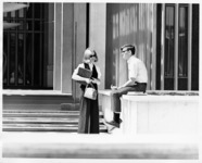 <span itemprop="name">Two unidentified students talking in front of...</span>