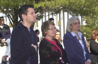 <span itemprop="name">The audience seated outside at a peace vigil for...</span>