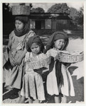 <span itemprop="name">A woman with two small children. The woman has her...</span>