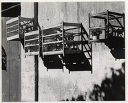 <span itemprop="name">Four birdcages mounted to the wall....</span>