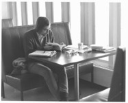 <span itemprop="name">An unidentified male student studying in a booth...</span>