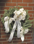 <span itemprop="name">A wreath was hung at the Civil Service Employees...</span>
