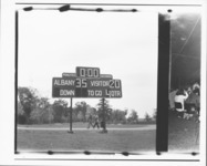 <span itemprop="name">A photograph of a scoreboard during a game in...</span>