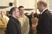 <span itemprop="name">Two unidentified men speak with newly appointed...</span>