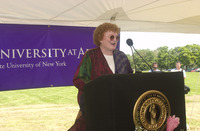 <span itemprop="name">Unidentified person speaks at the groundbreaking...</span>
