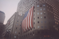 <span itemprop="name">A large tattered flag flies from the façade of a...</span>