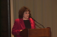 <span itemprop="name">An unidentified person speaks at the dedication...</span>