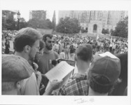<span itemprop="name">A group of unidentified people singing during a...</span>