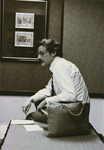<span itemprop="name">John M. "Tim" Reilly seated on a table while...</span>