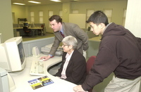 <span itemprop="name">Tom Mackey demonstrates a task on the computer as...</span>
