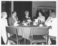 <span itemprop="name">A group of unidentified alumni sitting at a table...</span>